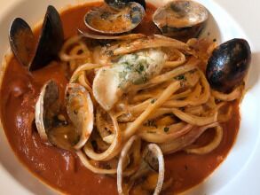 Chris makes a red clam sauce for his pasta.