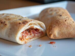 A rolled calzone-like dish you can make with pizza dough and whatever's kicking around.